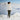 Person standing on a snowy mountain with a white background